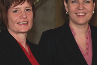 Judy Line CEO of Women's Housing Limited with Minister Tanya Plibersek at the Women's Housing Futures Conference sponsored by mecu.